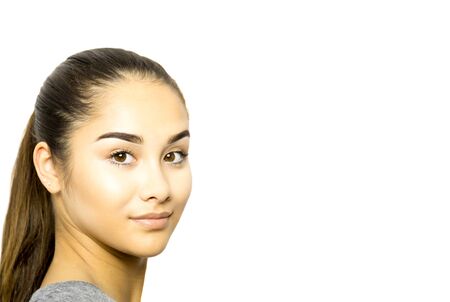 Beautiful mixed race young woman face isolated in white backgroundの写真素材