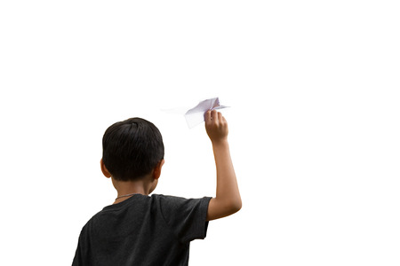 Little boy playing paper plane isolated in white backgroundの写真素材