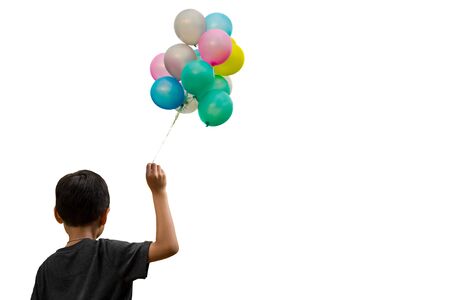 Little boy holding colorful balloons isolated on white backgroundの写真素材
