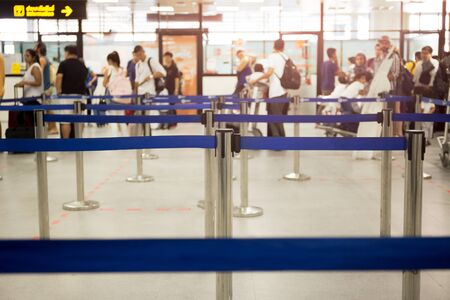 Passengers check-in line at the airport on vacationの写真素材