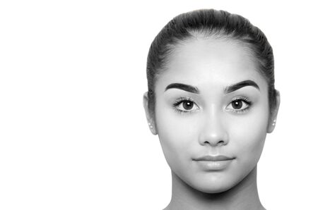 Black and white beautiful mixed race young woman face isolated in white backgroundの写真素材