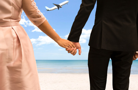 Bride and Groom holding hand on honeymoon in tropical Islandの写真素材
