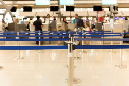 Passengers check-in line at the airport on vacationの写真素材