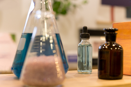 Transparent glass bottles filled liquid with dropperの写真素材