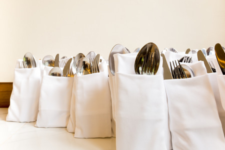 Hotel restaurant napkin mock fork and spoon in napkin setの写真素材