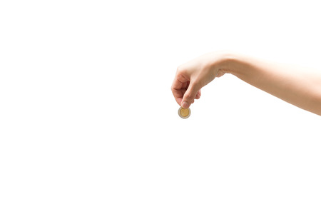 Woman hand holding coin isolated on white backgroundの写真素材