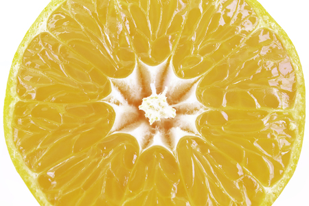 Close up macro slice of fresh orange isolated on white background in clipping path.の写真素材