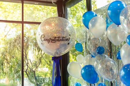 Balloons with word Congratulation on ballon decoration in the restaurant.の写真素材
