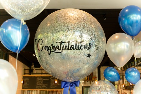 Balloons with word Congratulation on ballon decoration in the restaurant.の写真素材