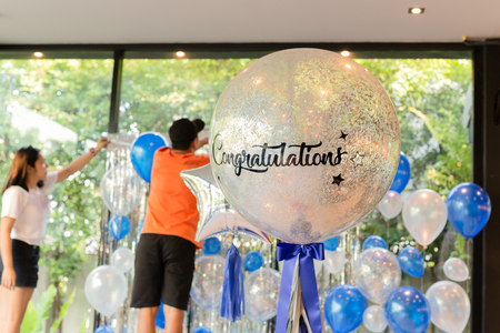 Couple of friends decoration balloons with word Congratulation.の写真素材