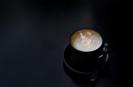 Coffee cup with spoon on darkの写真素材