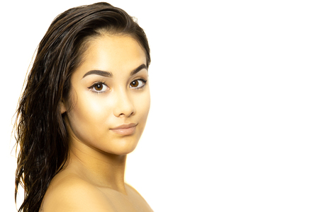Portrait mixed race young woman face isolated on whiteの写真素材