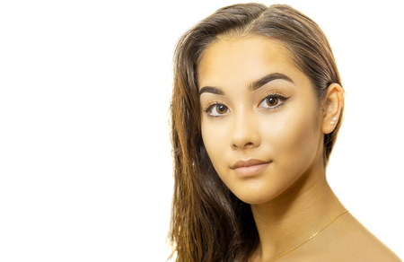 Mixed race young woman face portrait isolated on whiteの写真素材