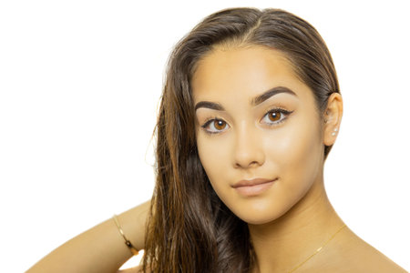 Mixed race young woman face portrait isolated on whiteの写真素材