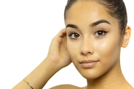 Mixed race young woman face portrait isolated on whiteの写真素材