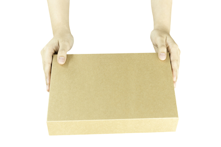 Female hand with brown parcel box isolated in clipping path.の写真素材