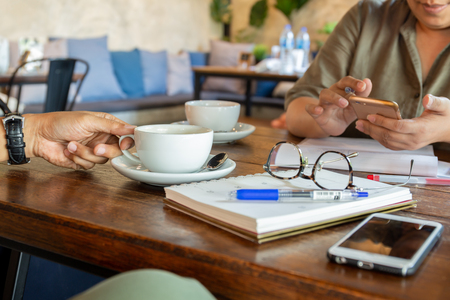 Business people at meeting in cafe having coffee break.の写真素材