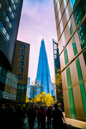City building London with blurred motion of tourists in the foreground.の写真素材