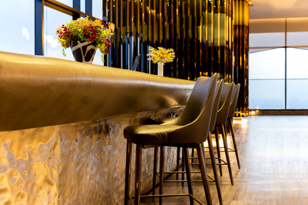 Interior design row of modern leather stools chair in luxury lounge.の写真素材