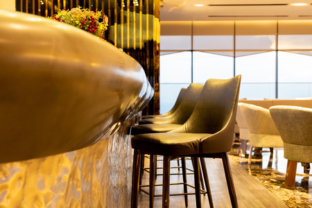 Interior design row of modern leather stools chair in luxury lounge.の写真素材