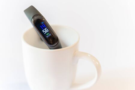Healthcare fitness bracelet display detail on monitor in whiteの写真素材