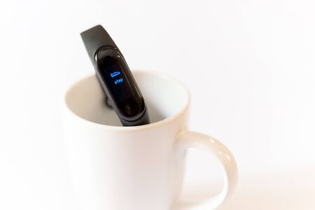 Health care concept Fitness bracelet display of foot step in whiteの写真素材