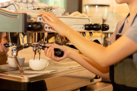 Barista making fresh coffee with machine in coffee shop or cafe.の写真素材