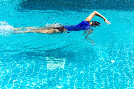 female swimmer training in the swimming pool.の写真素材