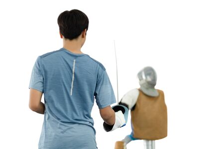 Selected focus hand holding sword practicing with target mannequin.の写真素材