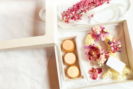 French profiteroles in gift box with flowerの写真素材
