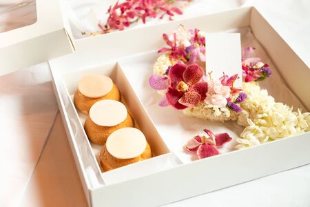 French profiteroles in gift box with flowerの写真素材