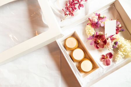 French profiteroles in gift box with flowerの写真素材