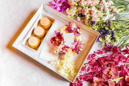 French profiteroles in gift box with flowerの写真素材
