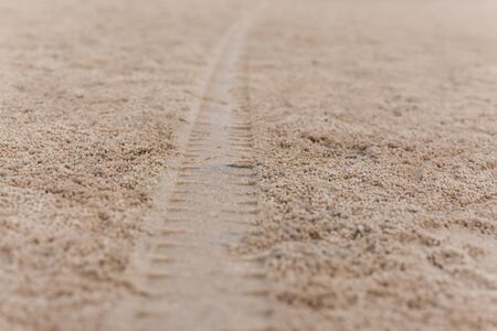 Car Tyre track on sandy beach.の写真素材