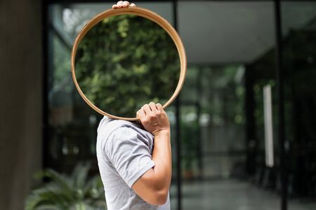 Man carrying a mirrors for house decoration.の写真素材