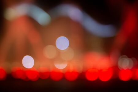 Fountain show with red bokeh color light illumination abstract.の写真素材