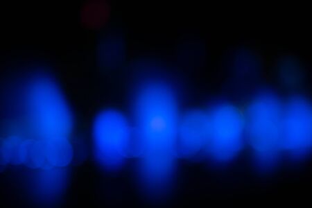 Blue bokeh abstract light in blackの写真素材