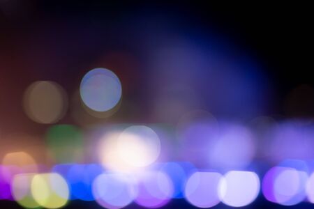 Abstract multicolor bokeh light texture on blackの写真素材