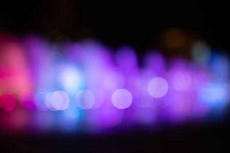 Fountain show with multicolor bokeh color light illumination abstract.の写真素材