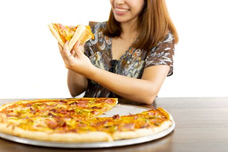 Happy woman holding pizza slices in hands isolated in white backgroundの写真素材