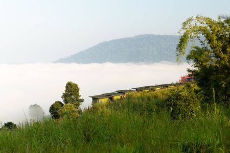 Resort village of foggy mountain at sunrise.の写真素材