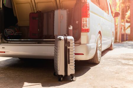 Carry-on luggage bag in mini bus travel concept.