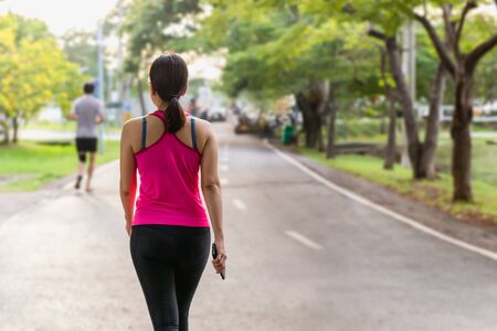 Attractive women exercise walking in the park.の写真素材