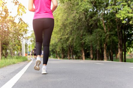 Woman exercise walking in the park in morning.の写真素材