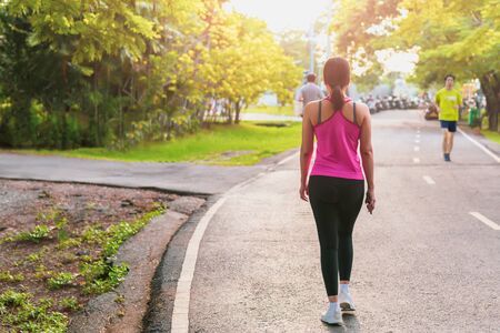Attractive women exercise walking in the parkの写真素材