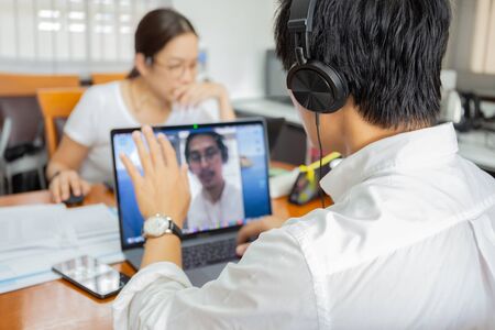 Businessman making video conference using laptop work from home prevent covid-19 concept