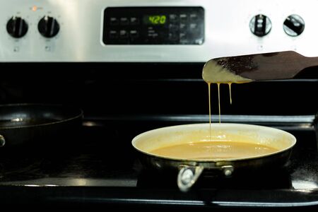 Homemade caramel cooking Process in frying pan.の写真素材