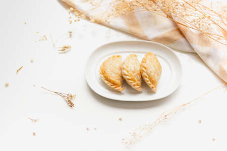 Thai traditional pastry curry puffs on white background.の写真素材