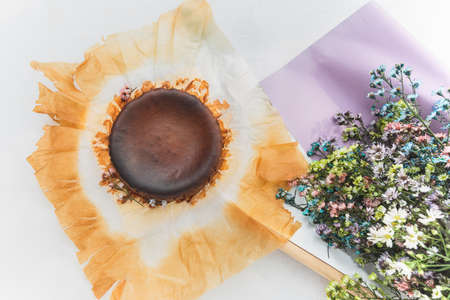 Top view of chocolate basque burnt cheesecake bouquet flowers.