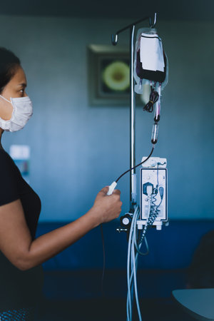 Nurse in hospital with blood products, infusion of donor blood.の写真素材